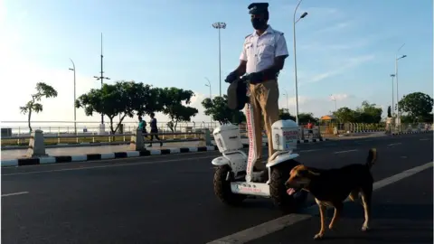 Getty Images A traffic police officer rides a self-balancing scooter in Chennai