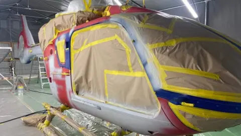 Thames Valley Air Ambulance Helicopter being resprayed