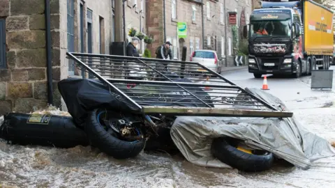 Rod Kirkpatrick/F Stop Press Damage to road