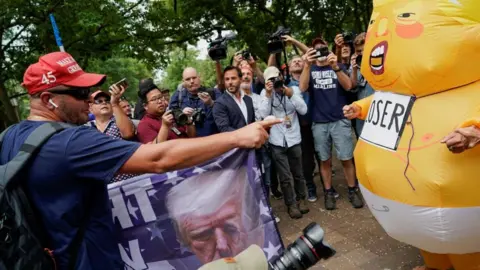 Reuters Demonstrators outside court for Donald Trump's arraignment in Washington DC on 3 August 2023