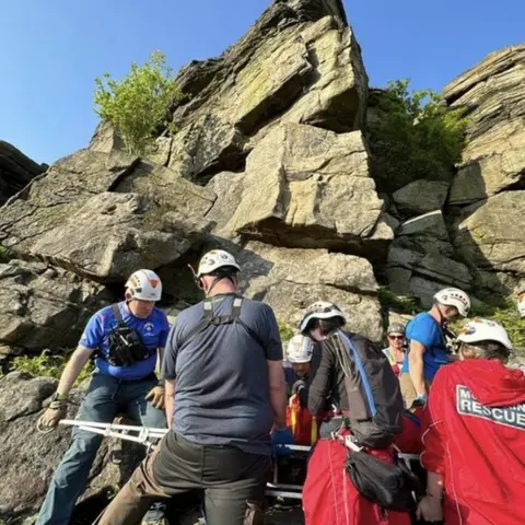 Edale Mountain Rescue Team Climber is rescued by mountain rescue volunteers