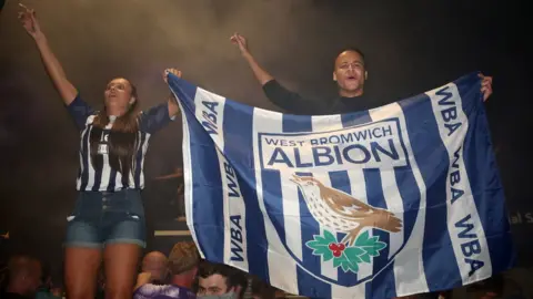 PA Media West Bromwich Albion fans celebrate promotion