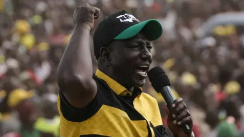 AFP Kenya's Deputy President William Ruto speaks on a stage during his first rally after being officially nominated as a Presidential candidate