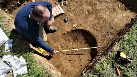 George Nash A man in an excavation