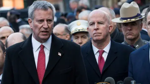 Getty Images New York City Mayor Bill de Blasio (left) and New York City Police Commissioner James O'Neill (right) hold a press briefing outside the New York Port Authority Bus Terminal, on 12 December 2017 in New York City.