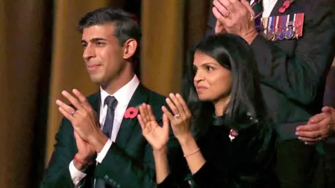 PA Media Prime Minister Rishi Sunak and his wife Akshata Murthy at the Festival of Remembrance