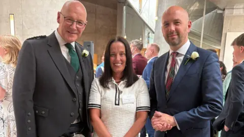 Lisa Petrie Lisa Petrie at Holyrood with First Minister John Swinney and MSp Ben Macpherson