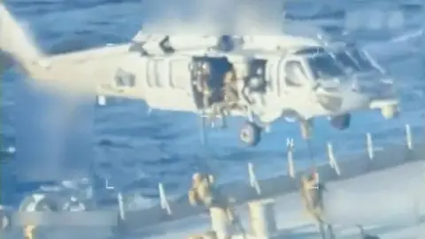 US forces abseil on to an oil tanker in a video released on 10 December 2025