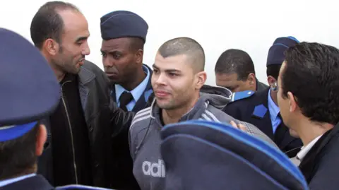 Getty Images Paul Allen, one of 4 suspects arrested in Morocco for the theft last February at a Securitas cash depot in Tonbridge, leaves court in Rabat escorted by police