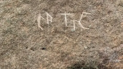 Historic Environment Scotland graffiti on Machrie Moor standing stone