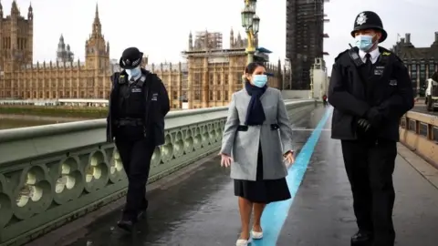 Reuters Home Secretary Priti Patel with Met Police officers