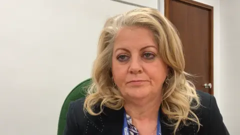 A woman with long blonde hair