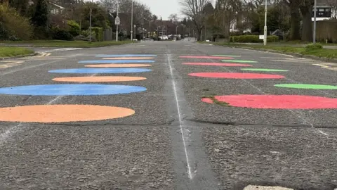 Richard Smith/BBC Spots on a road near a school
