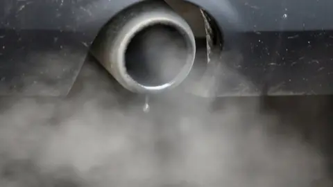 Reuters An exhaust emits fumes as a car is driven