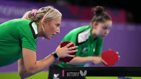 PA Media Charlotte Carey and Anna Hursey playing table tennis