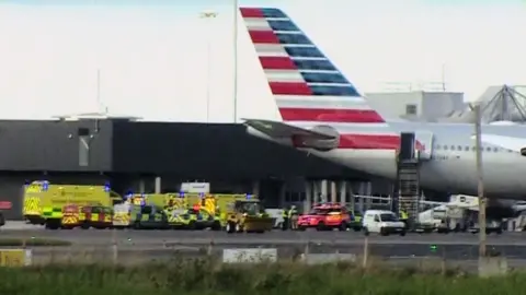 BBC Emergency vehicles near an American Airlines plane at Dublin airport