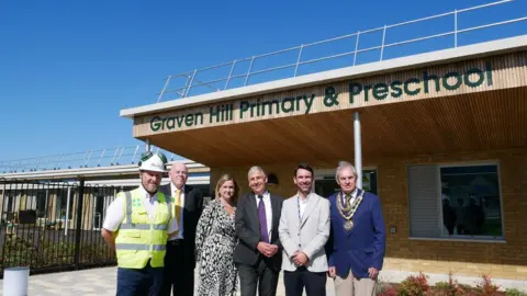 GHVDC Opening of Graven Hill school: (l-r) Andy Bolas (Kier), Tony Brady, Gemma Davis, Adrian Unitt, Matt Green (Head Teacher of Graven Hill Primary School), Councillor Sibley (CDC)