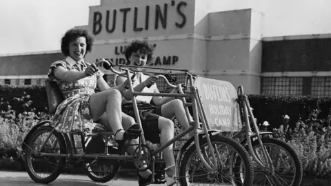 Hulton Archive Two women on tandem at Butlins