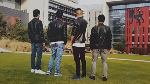 Hassan Hassan and friends outside Birmingham City University