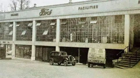 Hendy Group A vintage black Ford Anglia outside Hendy Ford's former dealership in Southampton.