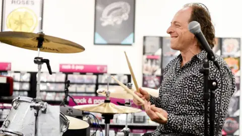 Getty Images Julian Richer playing the drums