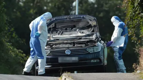 Pacemaker Forensic officers examine a vehicle believed to be linked to the incident