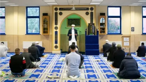 PA Media Imam Qari Asim during worship at the Makkah Masjid in Leeds