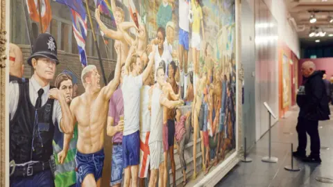 Nathan Chandler Man looks at portrait