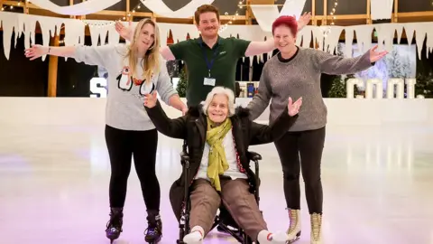 Paul Collins for Care South Eileen on the ice with staff from Alexandra House care home