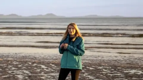 Ryan Scott Phillips Dani Robertson on a beach in Isle of Anglesey