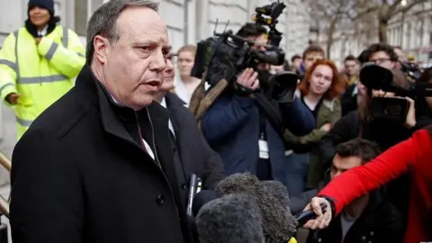 Reuters Nigel Dodds and other DUP MPs outside the Cabinet Office