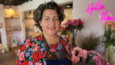 Shaun Whitmore/BBC Emma Quinn at her florist in Lowestoft