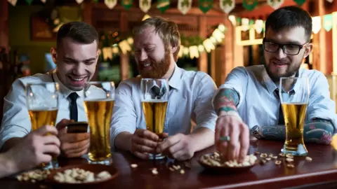 Getty Images Men drinking alcohol