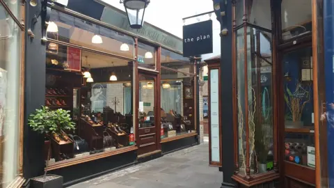 Two shops in the centre of the Morgan arcade