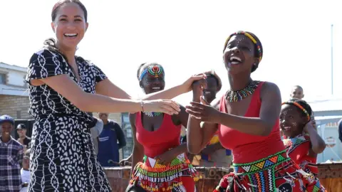 Getty Images Meghan joins dancers