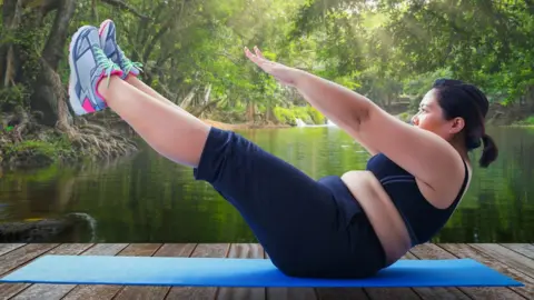 Getty Images Woman exercising outdoors