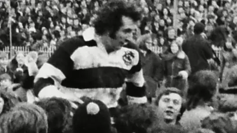 Rex Features Gareth Edwards is carried aloft after the final whistle of the game in which he scored his famous try