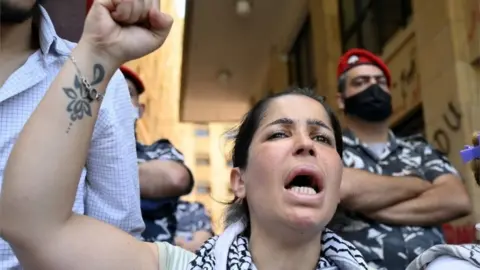 EPA Woman protests outside Ministry of Economy, Beirut (18/05/20)