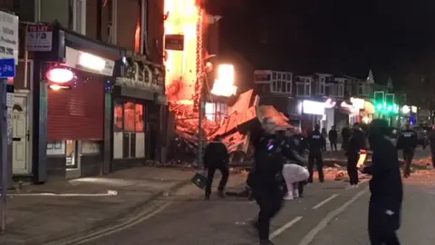 BBC People fleeing the scene of the blast