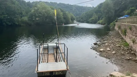 Crossing boat in shallow water on River Wye