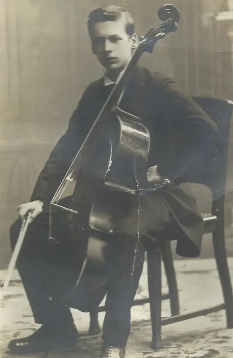 contributed An aged and slightly crumpled photograph of Fritz Ball playing cello