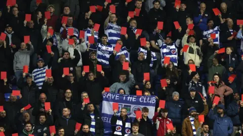 Getty Images Reading Fans holding red cards