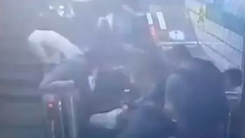 People were thrown to the floor and others tried to escape over the sides of the escalator.
