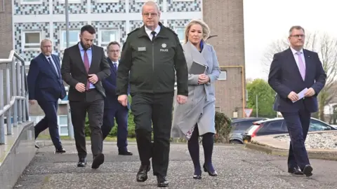 Pacemaker Simon Byrne with Doug Beattie, Colum Eastwood, Stephen Farry, Michelle O'Neill and Sir Jeffrey Donaldson