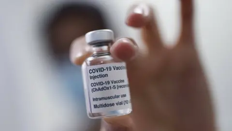 PA Media A vial of the Oxford/AstraZeneca coronavirus vaccine