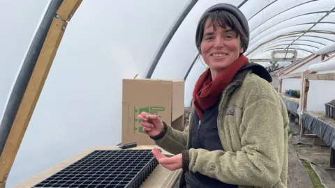 Sally Mees, Cooperative Member at Tyddyn Teg learnt on the job while working at the farm and now runs the plant nursey.