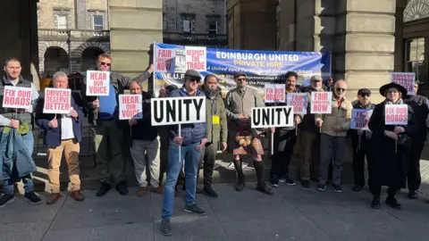 A protest involving private hire drivers outside the city chambers in Edinburgh.