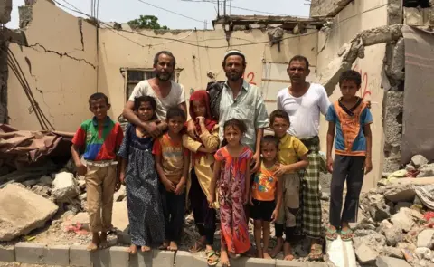 The Awal family in the wreckage of their home - hit by 2 #Saudi air strikes. Some of them still live in the ruins.