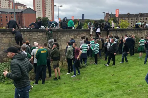 David Glennon Fans climbing out of the ground