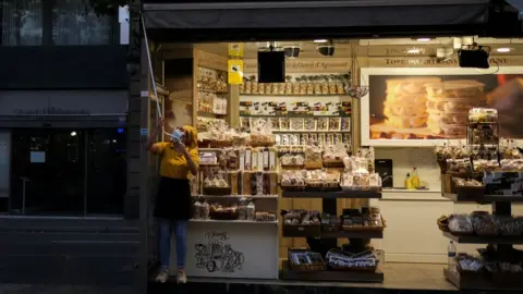 Reuters Shopkeeper closing up in La Rambla, Barcelona